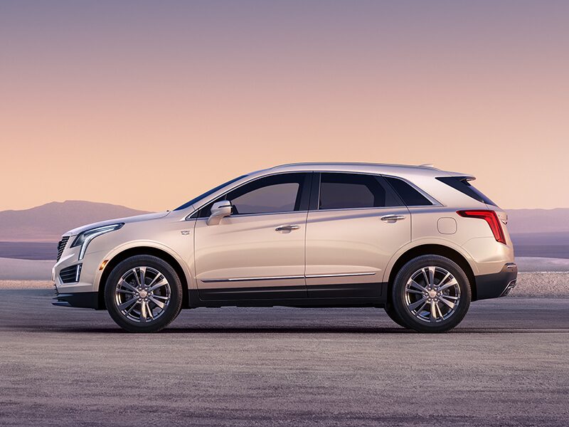Profile Driver Side View of a White 2026 Cadillac XT5 Parked in the Desert