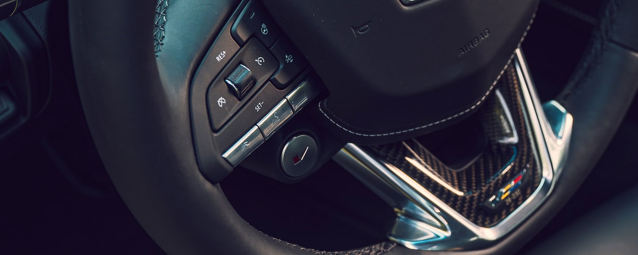 Close-up View of a Cadillac Performance V-Series Vehicle Steering Wheel.