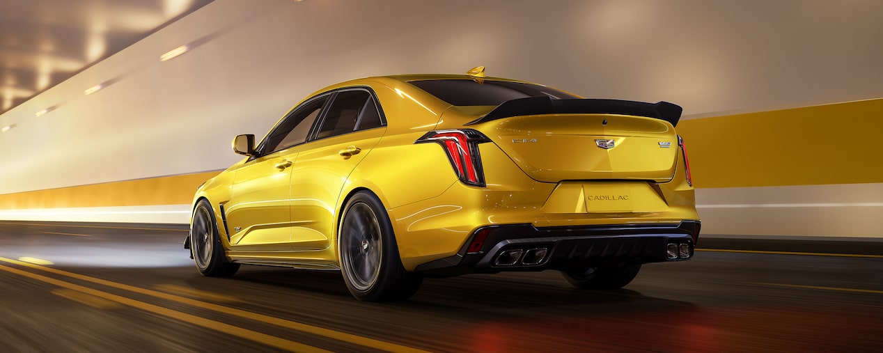 A Yellow CT4-V Blackwing Driving through a Tunnel with It's Headlights On