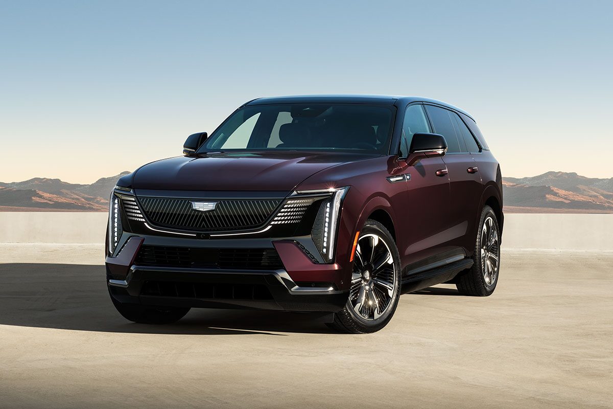 Three-quarters Driver Side View of the 2026 ESCALADE IQ Long Range EV Parked in the Desert