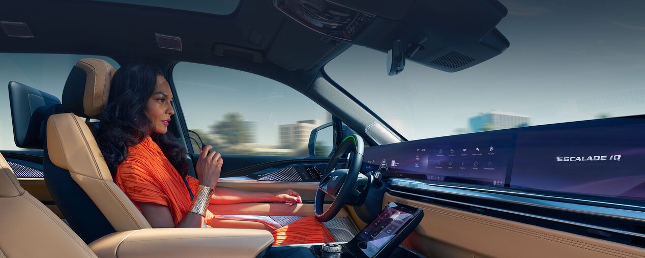 Passenger View of a Woman Driving a Cadillac with Hands Off the Steering Wheel and Utilizing the Super Cruise Feature