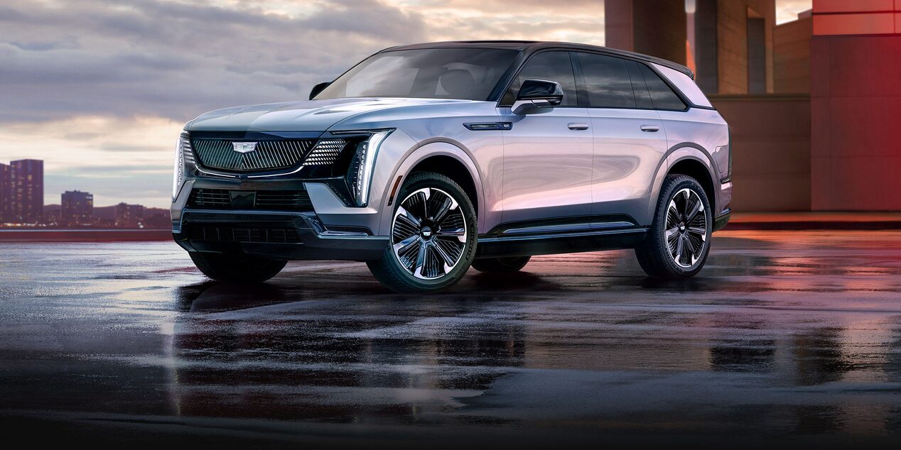 Three-quarter View of a 2025 Cadillac ESCALADE IQ Parked Outside Under an Overpass